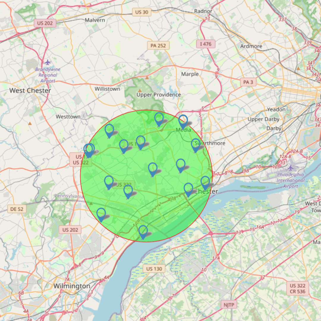 Map showing a highlighted green circular area with blue location pins around West Chester and Wilmington.